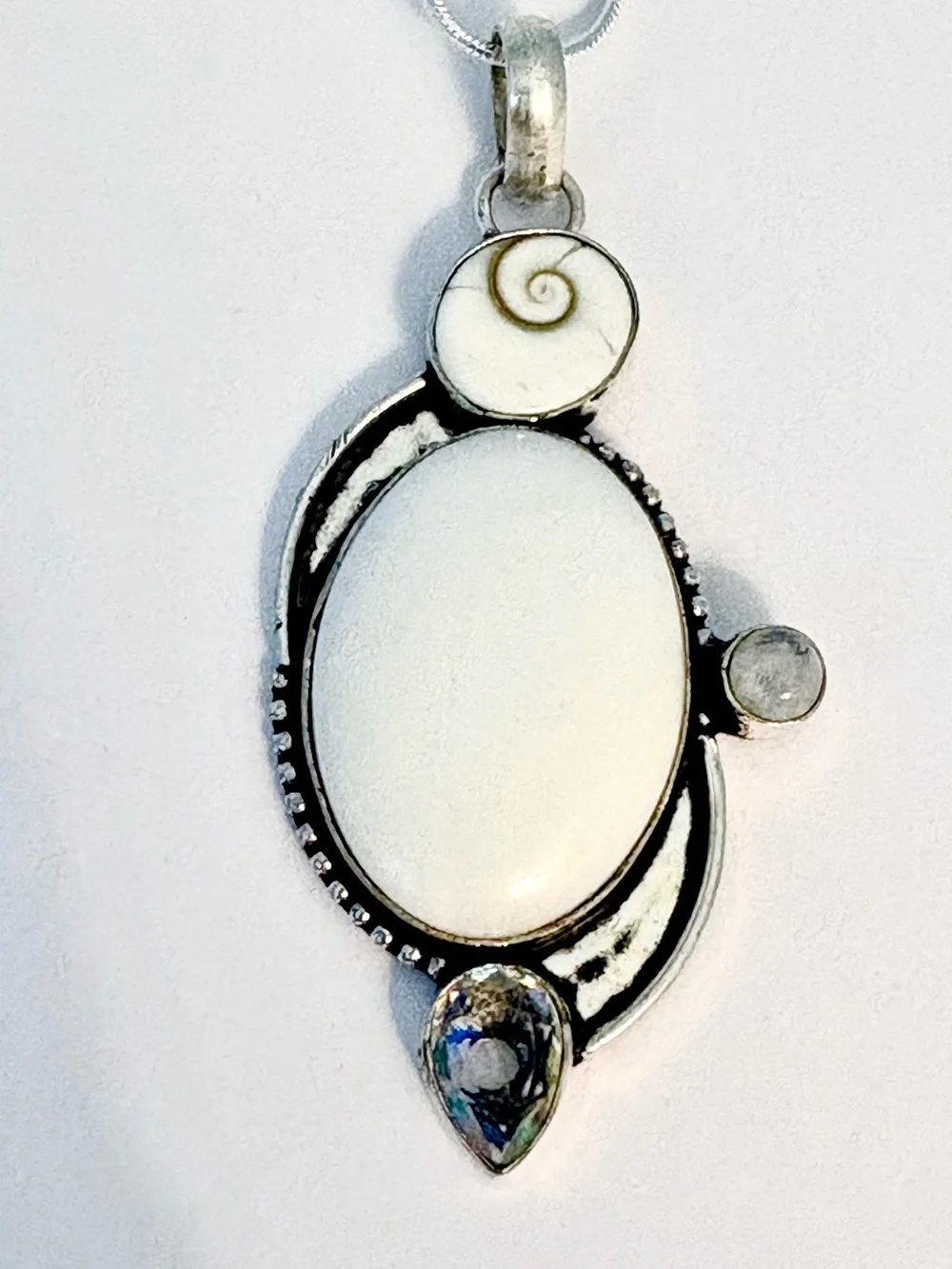 White Opal, Shiva Eye, Mystic Topaz and Moonstone pendant on silver chain.